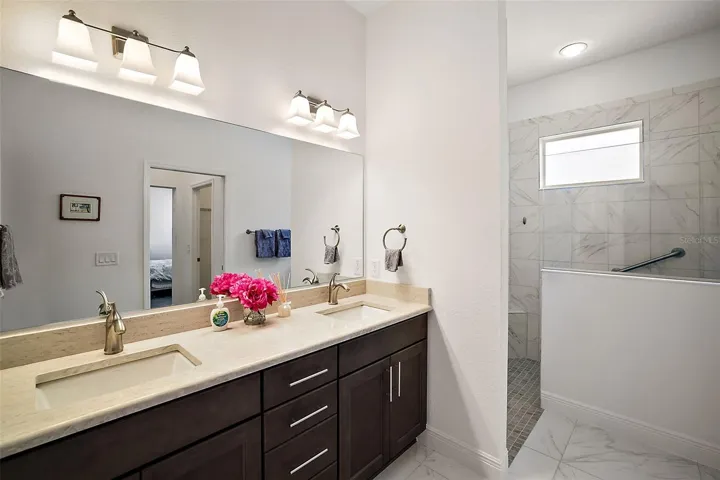 Primary bathroom with dual vanity sinks