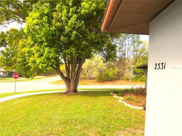 Located In Popular Citrus Springs, FL on Gorgeous Corner Site With Vinyl Fenced Back Yard.