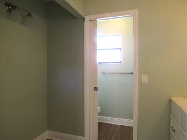 Pocket Door To Water Closet w/ Window and Shower.