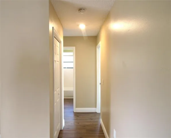 Hallway With LG Linen Closet To Primary Bedroom W/ En~Suite Bath, Bedroom #2 + Guest Bath.