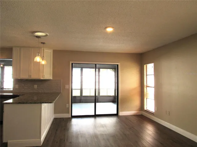 A Delightful Classy-Comfy Dining Area Open From Kitchen With Glass Sliding Doors To Screen Enclosed Lanai!