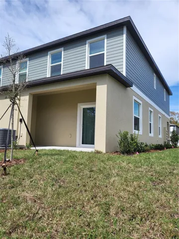 BACK OF TOWNHOUSE SHOWING PATIO