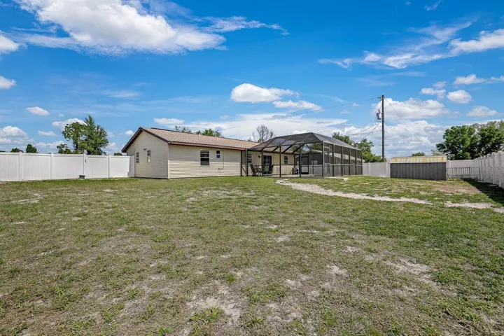 This shows the oversized lot with plenty of room for gardening.