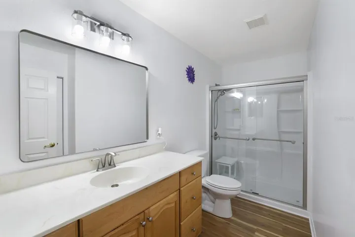Guest Bathroom has new mirror, lighting and shower.