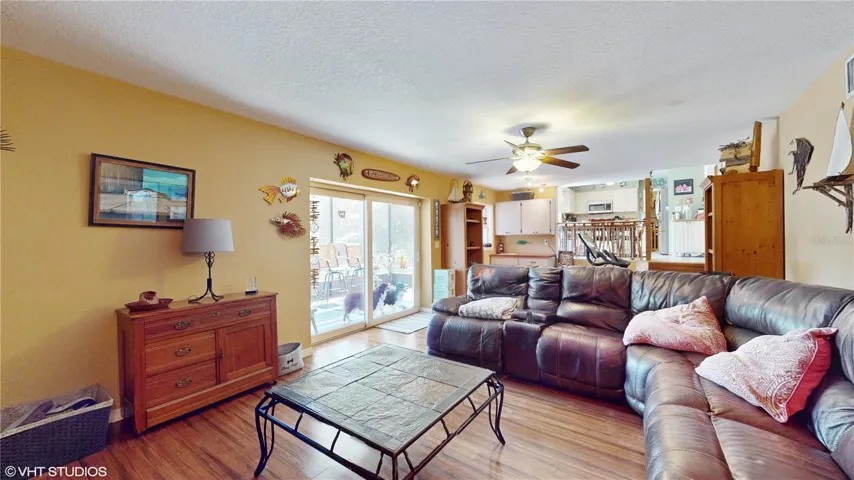 Family room opens to porch and pool