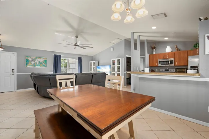 Dining area, kitchen and living room.