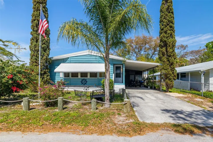 Welcome home!  NPR 2 bed/ 2 bath Manufactured home with SOLAR panels,  indoor laundry room, carport & workshop!