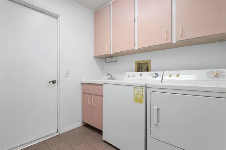 Laundry Room with folding table attached to wall