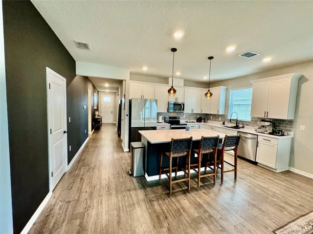 Accent wall can be painted neutral color or left as is.