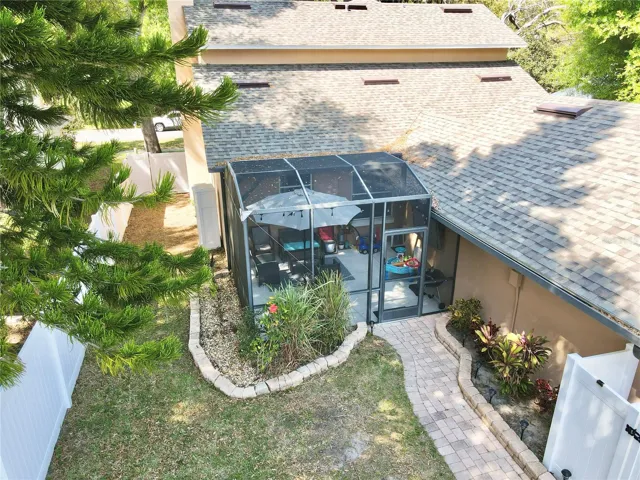 Aerial view of the back yard and screened-in porch