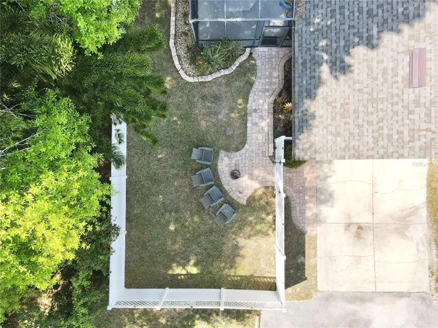 Aerial view of the back yard and rear-facing garage