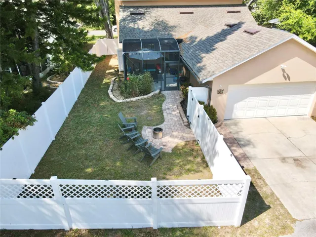 Aerial view of the back yard and rear-facing garage