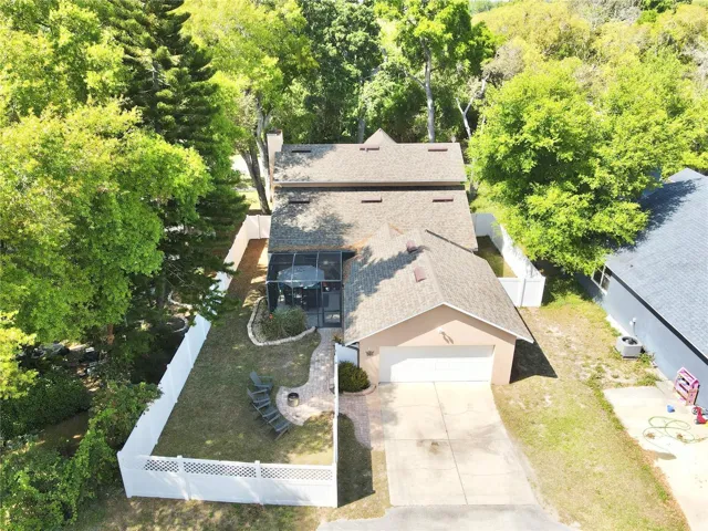 Aerial view of the back of the house and rear-facing garage