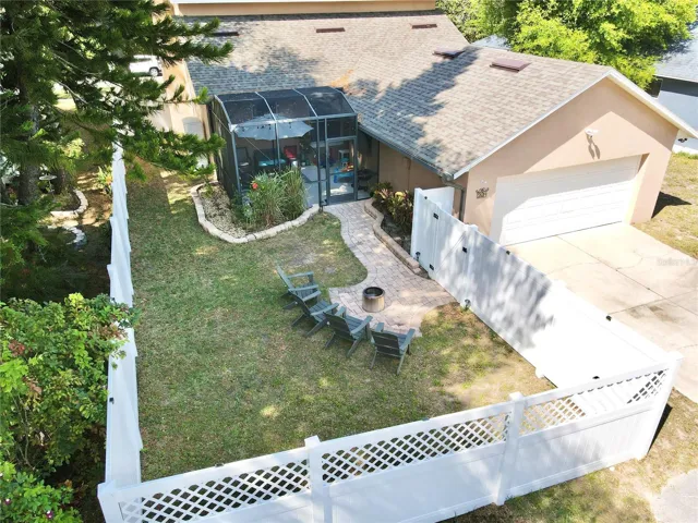 Aerial view of the back yard and rear-facing garage