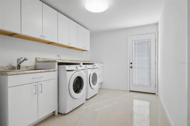Inside laundry & loads of storage space