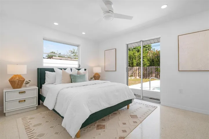 The main bedroom is sunny and has convenient access to the backyard.