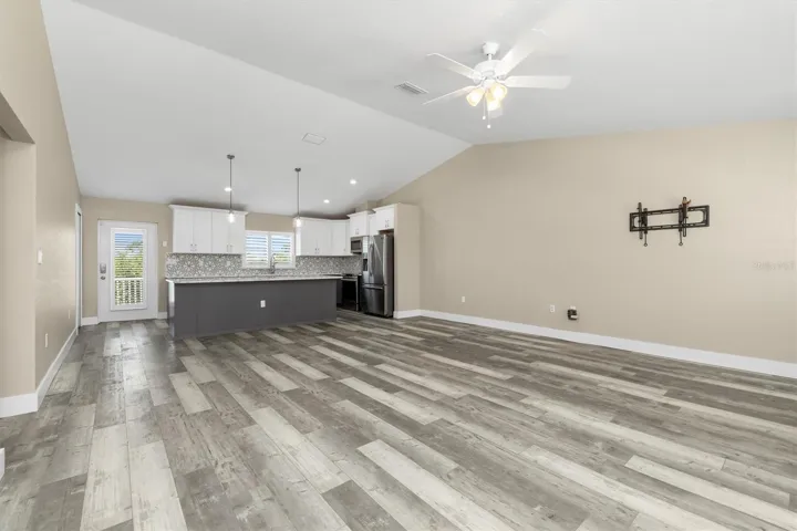 No carpet to deal with. Distressed vinyl plank flooring throughout.