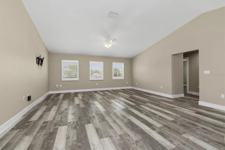 Looking into dining/living area from kitchen. Bedrooms off to the right.