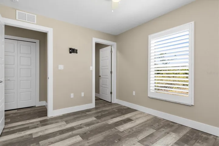 Bedroom on left has walk-in closet.