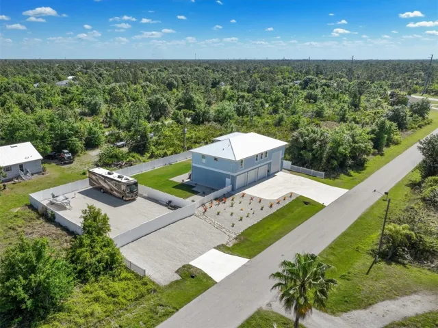 Bring home all your toys on this large 160ft x 100ft property!!
