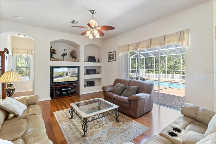 Family Room with Built-Ins & 3 Panel Pocket Slider to the Pool