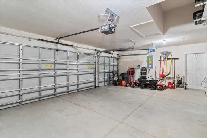 3 Car Garage w/ Garage Door Openers, Recessed Air Handler & Pull Down Stairs for Storage Access