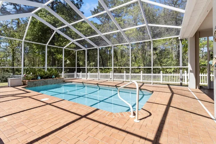 Covered, Screened Lanai w/ Pavers & Solar Heated Pool w/ Salt System & Waterfall