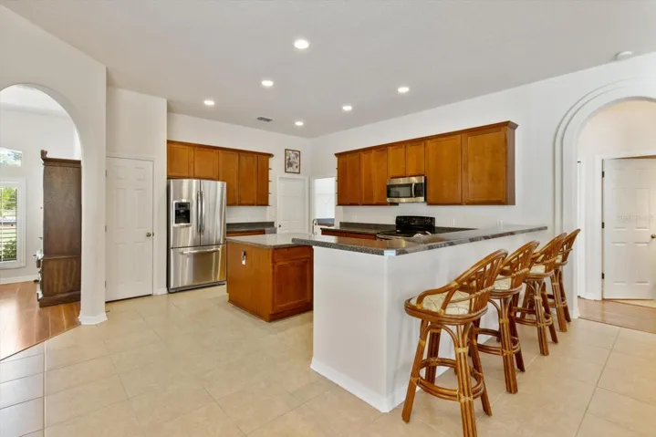 Kitchen w/ Plenty of Cabinets & Countertop space, Island w/ 2nd sink, Breakfast Bar & Pantry Closet
