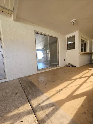 Back Porch - view of Sliding Doors, featuring breakfast bar outside kitchen window