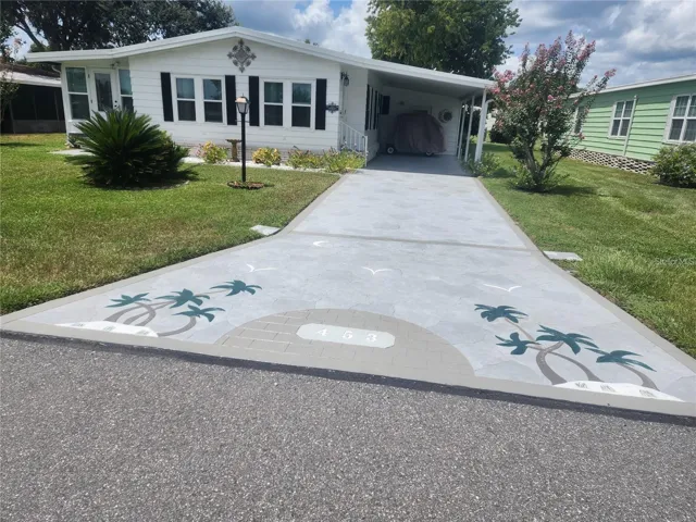 Front with artistic iengraved driveway