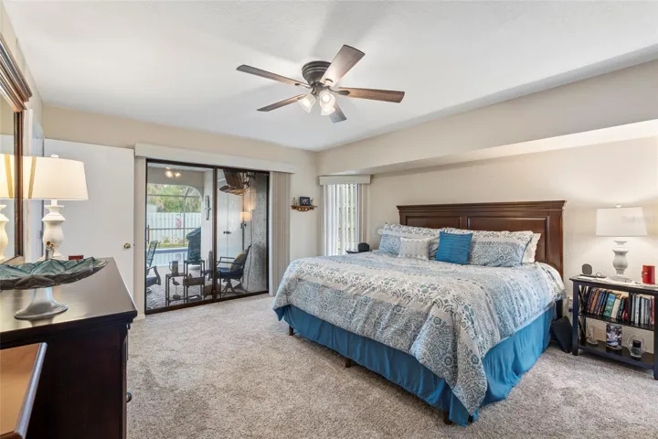 Primary Bedroom with sliders leading to pool