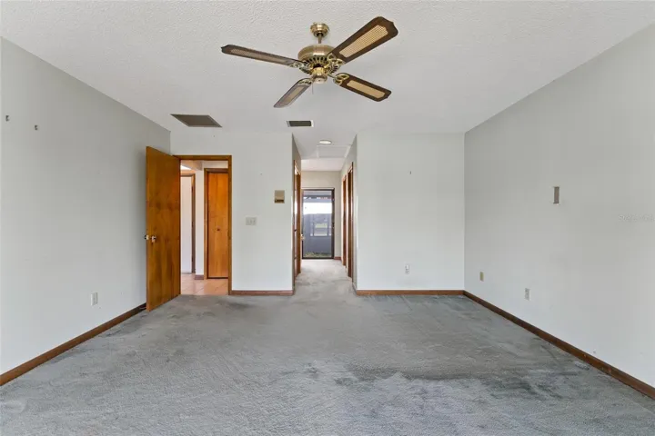 primary bedroom towards walk in closet and on suite bathroom