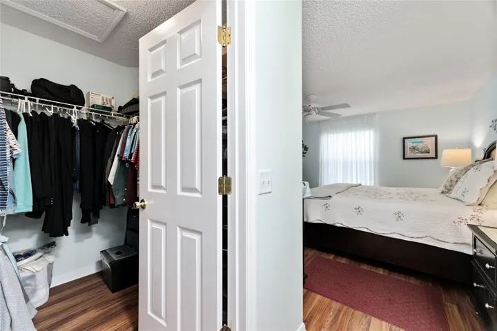 WALK-IN CLOSET in PRIMARY BEDROOM (across from sink/vanity)