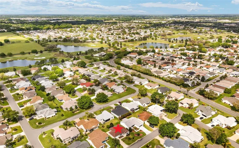 AERIAL looking WEST/ NORTHWEST - BELMONT EXECUTIVE GOLF COURSE (L) is located close to LYNNHAVEN POOL & PO BOXES on Churchill Downs. Swainwood Villas is located across the street from LYNNHAVEN POOL (R center).