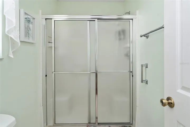 ENSUITE BATHROOM  w/ COMFORT HEIGHT TOILET & WALK-IN SHOWER