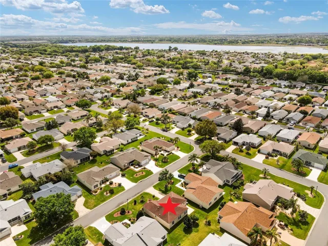 AERIAL looking SOUTHEAST - CR 472/Rainey Trail at the R edge of the photo is visible with Lake Miona sitting on the horizon.