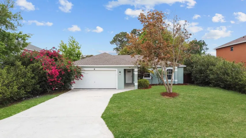 Gorgeous bougainvilla and other tropical plants surround the home!
