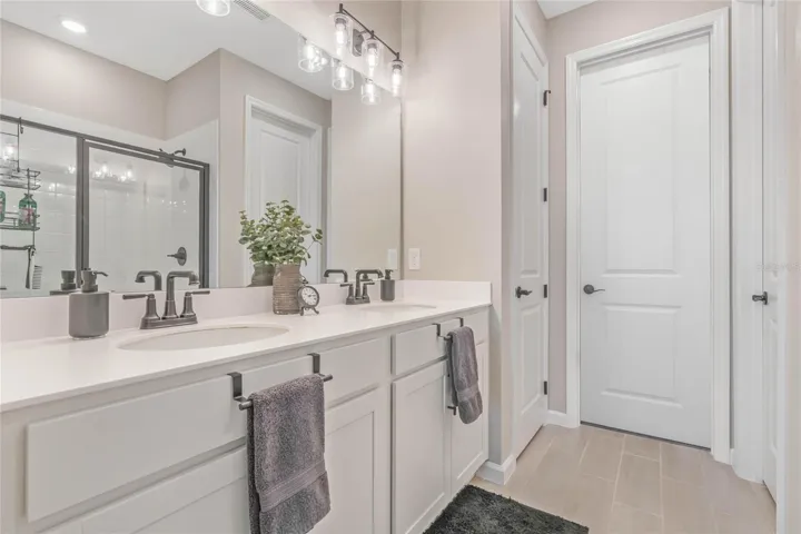 Master Bathroom with Comfort Height Vanity featuring Dual Sinks
