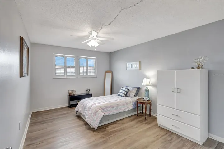 Bedroom is large and spacious with planation shurtters on windows