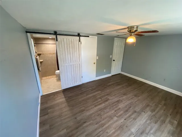 Master Bedroom with barn door to master bathroom