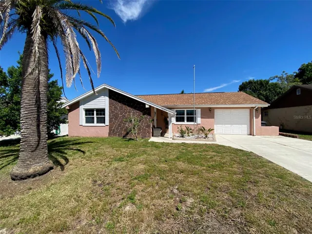 Front exterior with double wide driveway