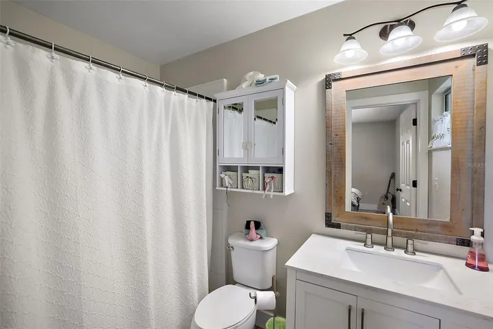 Primary Bathroom - custom step-in shower, no tub.