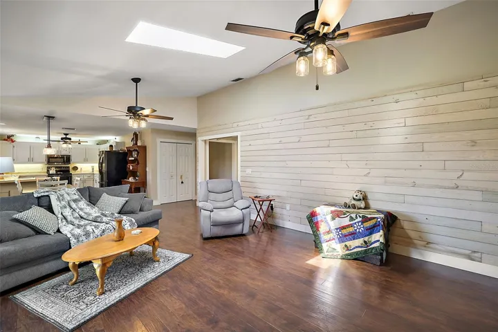 Living Room is open to Dining and Kitchen.
