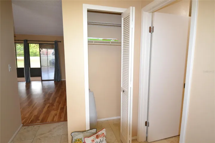 Front Entrance Coat closet bedroom to the right