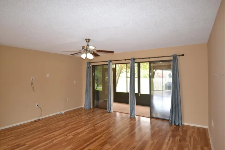 Living Room and view of Large Lanai looking at Golf Course