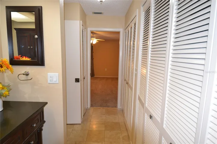 Wall of closets to the largest bedroom