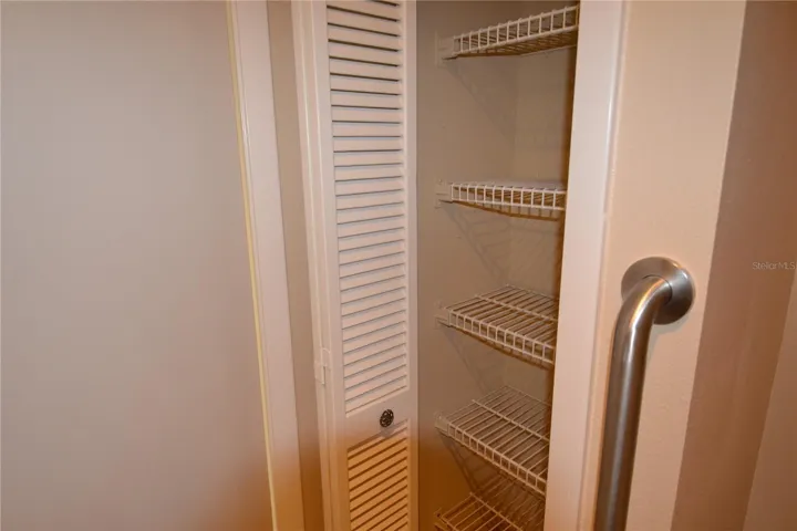 Small shelf closet in vanity area but large enough for toiletries