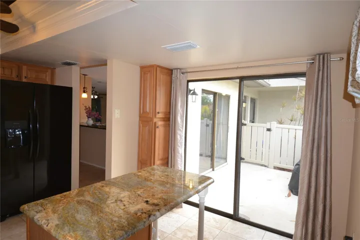 Kitchen breakfast table and slider to front patio