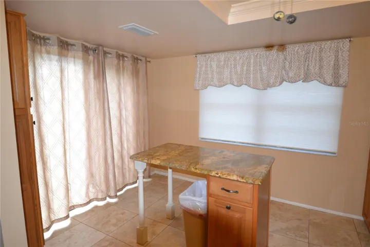 kitchen with window shade drawn