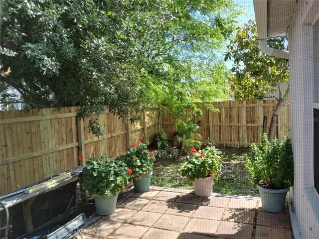 Side yard also fully fenced with stone patio